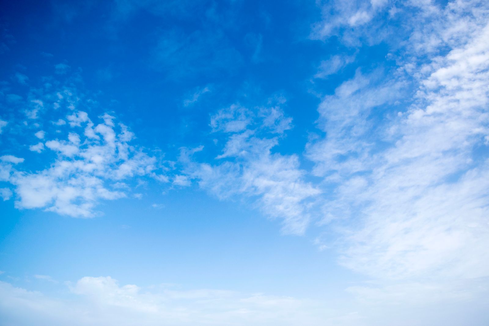 Soft blue sky with gentle clouds